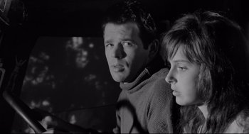 Movie still from “Two Women” (1960), directed by Vittorio De Sica – A man and a woman looking at the camera; Close Up shot, Low angle