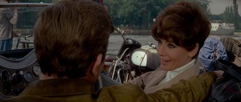 Movie still from “Two for the Road” (1967), directed by Stanley Donen – A woman sitting next to a man on a boat; Close Up shot, Over the shoulder angle