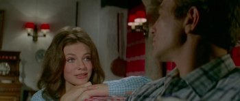 Movie still from “Two for the Road” (1967), directed by Stanley Donen – A man and a woman sitting next to each other in a room; Close Up shot, Over the shoulder angle