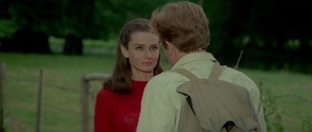 Movie still from “Two for the Road” (1967), directed by Stanley Donen – A man and a woman standing next to each other; Close Up shot, Over the shoulder angle