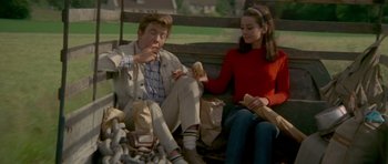 Movie still from “Two for the Road” (1967), directed by Stanley Donen – A man and a woman sitting next to each other on top of a park bench; Medium shot, High angle