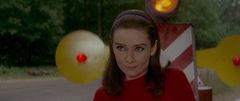 Movie still from “Two for the Road” (1967), directed by Stanley Donen – A person wearing a red shirt; Close Up shot, Over the shoulder angle