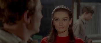 Movie still from “Two for the Road” (1967), directed by Stanley Donen – A person wearing a red shirt; Close Up shot, Over the shoulder angle