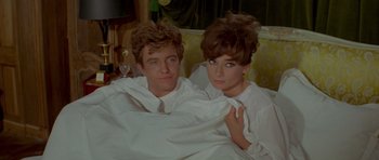 Movie still from “Two for the Road” (1967), directed by Stanley Donen – A man and a woman pose for a picture; Medium shot, High angle