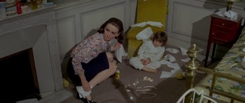 Movie still from “Two for the Road” (1967), directed by Stanley Donen – A woman and a little girl sitting on the floor; Medium shot, High angle