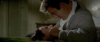 Movie still from “Two for the Road” (1967), directed by Stanley Donen – A man and a woman laying on the ground; Close Up shot, High angle