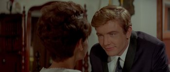 Movie still from “Two for the Road” (1967), directed by Stanley Donen – A man and a woman looking at one another in a mirror; Close Up shot, Over the shoulder angle