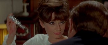 Movie still from “Two for the Road” (1967), directed by Stanley Donen – A woman's face in a white dress; Close Up shot, Over the shoulder angle