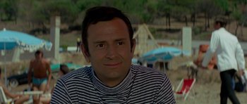 Movie still from “Two for the Road” (1967), directed by Stanley Donen – A person wearing a striped shirt; Close Up shot, High angle