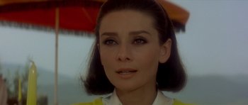 Movie still from “Two for the Road” (1967), directed by Stanley Donen – A person wearing a yellow shirt; Close Up shot, Over the shoulder angle