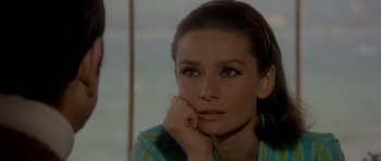 Movie still from “Two for the Road” (1967), directed by Stanley Donen – A person with her chin resting on her hand; Close Up shot, High angle