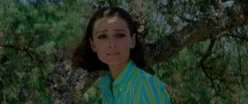 Movie still from “Two for the Road” (1967), directed by Stanley Donen – A woman in a green and blue striped shirt; Close Up shot, High angle