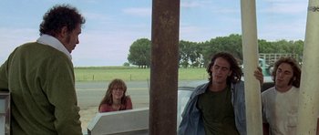 Movie still from “Two-Lane Blacktop” (1971), directed by Monte Hellman – A woman sitting in the back of a car next to a man; Medium shot, Low angle