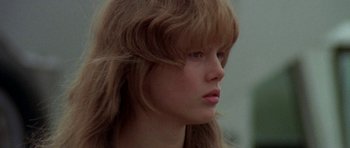 Movie still from “Two-Lane Blacktop” (1971), directed by Monte Hellman – A person with long brown hair; Close Up shot, Low angle