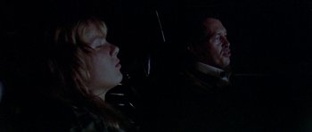 Movie still from “Two-Lane Blacktop” (1971), directed by Monte Hellman – A man and a woman in a car at night; Close Up shot, High angle