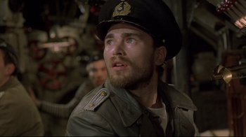 Movie still from “U-571” (2000), directed by Jonathan Mostow – A person wearing a hat; Close Up shot, Low angle
