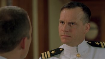 Movie still from “U-571” (2000), directed by Jonathan Mostow – A person wearing a uniform; Close Up shot, Over the shoulder angle