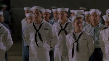 Movie still from “U-571” (2000), directed by Jonathan Mostow – A group of men in white sailor's uniforms; Medium shot, Low angle