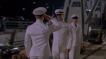 Movie still from “U-571” (2000), directed by Jonathan Mostow – A group of men standing next to each other in uniform; Medium shot, Low angle