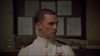 Movie still from “U-571” (2000), directed by Jonathan Mostow – A person wearing a uniform; Close Up shot, Low angle