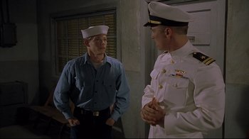Movie still from “U-571” (2000), directed by Jonathan Mostow – Two men in uniforms talking to each other; Medium shot, Over the shoulder angle