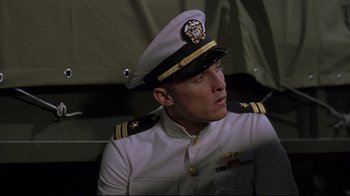 Movie still from “U-571” (2000), directed by Jonathan Mostow – A person wearing a uniform; Close Up shot, Low angle