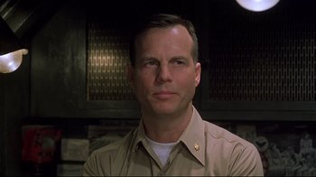 Movie still from “U-571” (2000), directed by Jonathan Mostow – A person wearing a uniform; Close Up shot, Low angle