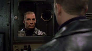 Movie still from “U-571” (2000), directed by Jonathan Mostow – A man looking at himself in the mirror; Close Up shot, Over the shoulder angle