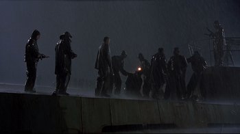 Movie still from “U-571” (2000), directed by Jonathan Mostow – A group of men standing on top of a concrete wall; Extreme Wide shot, Low angle