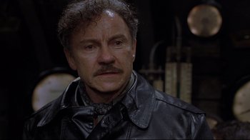 Movie still from “U-571” (2000), directed by Jonathan Mostow – A person wearing a leather jacket; Close Up shot, Low angle