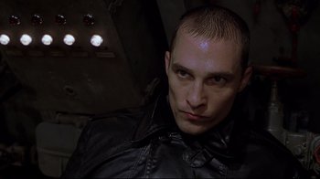 Movie still from “U-571” (2000), directed by Jonathan Mostow – A person wearing a leather jacket; Close Up shot, Low angle