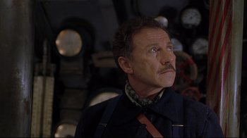 Movie still from “U-571” (2000), directed by Jonathan Mostow – An older man with a mustache looking up; Close Up shot, Low angle