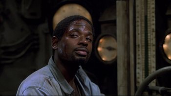 Movie still from “U-571” (2000), directed by Jonathan Mostow – A black man with blood all over his face; Close Up shot, Low angle