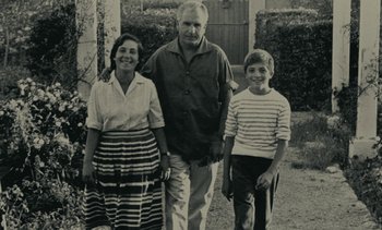 Movie still from “Ulysse” (1983), directed by Agnès Varda – An old black and white photo of a man and a woman and a boy; Medium shot, High angle