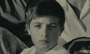 Movie still from “Ulysse” (1983), directed by Agnès Varda – A black and white photo of a young boy; Close Up shot, High angle