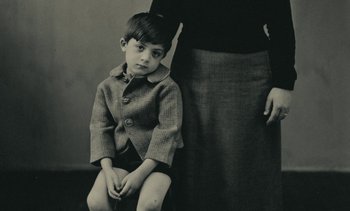 Movie still from “Ulysse” (1983), directed by Agnès Varda – An older woman standing next to a young boy; Medium shot, High angle