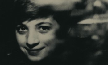 Movie still from “Ulysse” (1983), directed by Agnès Varda – A black - and - white photo of a woman's face; Extreme Close Up shot, Overhead angle