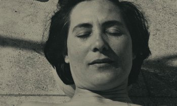 Movie still from “Ulysse” (1983), directed by Agnès Varda – A woman with her eyes closed and her head tilted to the side; Close Up shot, High angle