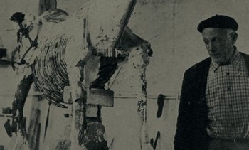 Movie still from “Ulysse” (1983), directed by Agnès Varda – A man standing in front of a wall with graffiti on it; Medium shot, Low angle