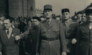 Movie still from “Ulysse” (1983), directed by Agnès Varda – A group of men standing next to each other in uniform; Medium shot, Low angle