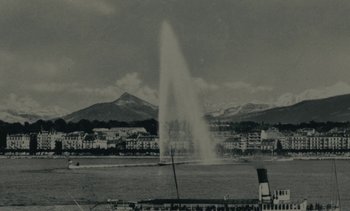Movie still from “Ulysse” (1983), directed by Agnès Varda – A black - and - white photo of a fountain in the middle of a city; Extreme Wide shot, High angle