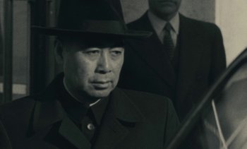 Movie still from “Ulysse” (1983), directed by Agnès Varda – A black and white photo of a man wearing a hat; Close Up shot, Low angle