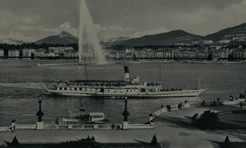 Movie still from “Ulysse” (1983), directed by Agnès Varda – A large boat in a body of water near some buildings; Extreme Wide shot, High angle