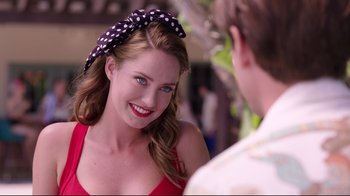 Movie still from “Unbroken: Path to Redemption” (2018), directed by Harold Cronk – A beautiful young woman wearing a polka dot head scarf; Close Up shot, Over the shoulder angle