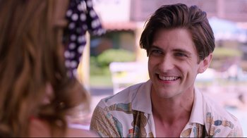 Movie still from “Unbroken: Path to Redemption” (2018), directed by Harold Cronk – A person smiling at the camera; Close Up shot, Over the shoulder angle