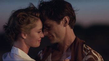 Movie still from “Unbroken: Path to Redemption” (2018), directed by Harold Cronk – A man and a woman face to face with their eyes closed; Close Up shot, Low angle