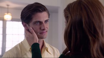 Movie still from “Unbroken: Path to Redemption” (2018), directed by Harold Cronk – A man and a woman looking in the same mirror; Close Up shot, Over the shoulder angle