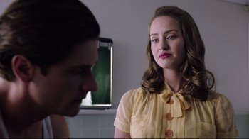 Movie still from “Unbroken: Path to Redemption” (2018), directed by Harold Cronk – A woman in a yellow shirt and a man in a yellow shirt; Close Up shot, Over the shoulder angle