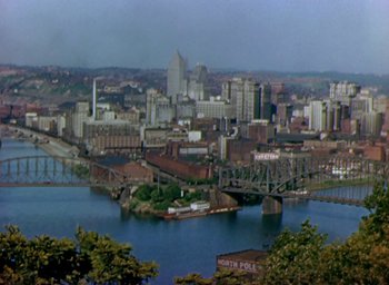 Movie still from “Unconquered” (1947), directed by Cecil B. DeMille – A view of a large city from a hill; Extreme Wide shot, High angle