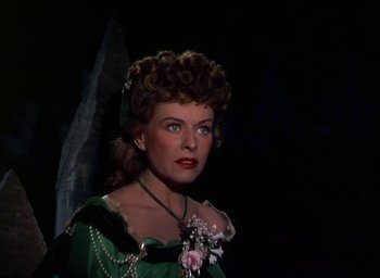 Movie still from “Unconquered” (1947), directed by Cecil B. DeMille – A person wearing a dress; Close Up shot, Over the shoulder angle